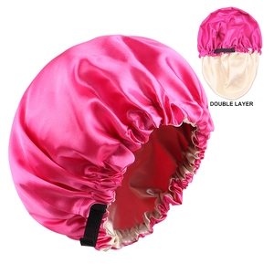 Detail of pink and beige double-layered satin sleep cap with adjustable elastic band
