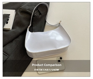 Close-up of a light purple patent leather shoulder bag with a curved zipper and slim strap