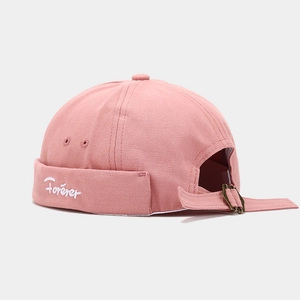 Detail of pink cotton Miki Hat featuring white Forever embroidery and metal strap adjustment