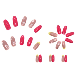 Fresh summer press-on nails with floral patterns and yellow French tips on white background