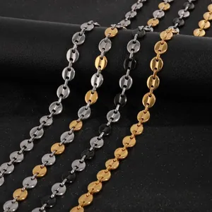 Collier grain de café en acier titane avec finitions argent, or et noir brillant