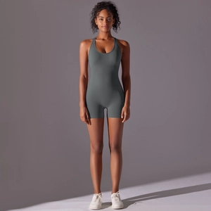 Detail of grey seamless yoga jumpsuit with U-neck straps and bodycon fit for fitness