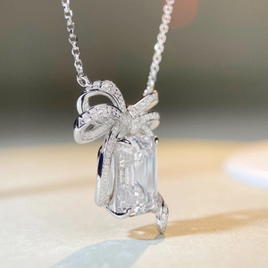 S925 sterling silver bow necklace with a sparkling emerald cut zircon pendant