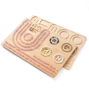 Bamboo jewelry design board showing multiple bead grooves with precise scale measurements