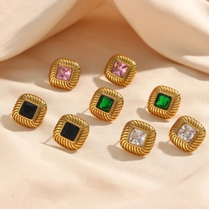 18K gold plated square zircon earrings with vintage wavy texture on beige satin background