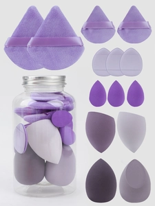 Detail of 14-piece purple makeup sponge set with various shapes and storage container