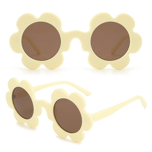 Close-up of cream floral petal sunglasses frame with dark round lenses for kids
