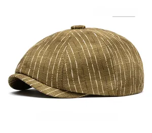 Close-up of army green newsboy cap featuring detailed stripe texture and vintage fabric