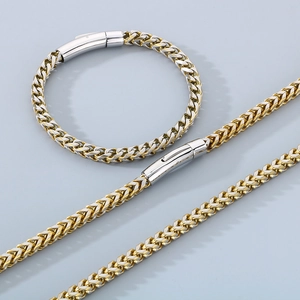 Ensemble collier et bracelet bicolores en acier titane tressé avec fermoir argenté