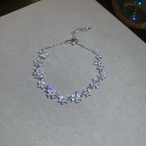 Macro shot of silver butterfly bracelet featuring marquise-cut zircons and adjustable chain