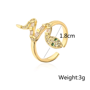 Detail of 18K gold plated snake ring with cubic zirconia stones and green eyes weight 3g
