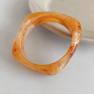 Retro irregular amber resin square bangle with marble texture for a vintage aesthetic
