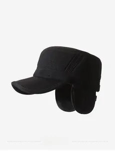 Detail of winter cadet cap for men with ear flaps and silver metal Sport emblem