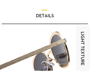Close-up of golden metal frame sunglasses with unique grainy embossed texture detail