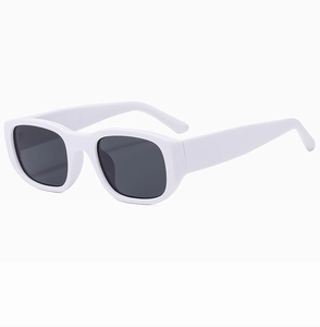 Detail of trendy white chunky rectangular sunglasses with premium dark lenses and thick frame