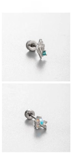 Macro shot of silver conch earring with blue zircon and heart opal screw back studs