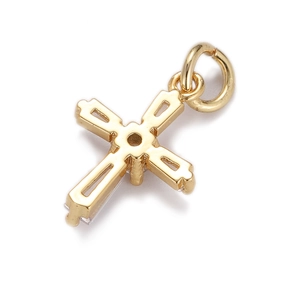 Macro shot of a high-quality gold-plated cross pendant with a polished metal finish