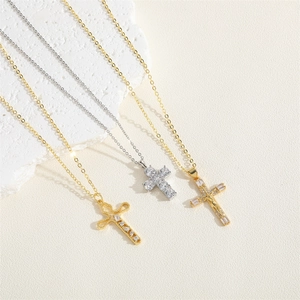 Three hollow cross necklaces with white cubic zirconia in gold and silver finishes