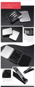 Detailed close-up of 5-piece stainless steel manicure set in silver aluminum storage case