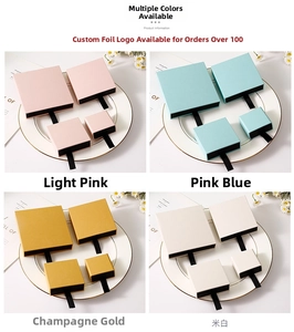 Detail of drawer jewelry boxes with ribbon handles in pink, blue, gold and white