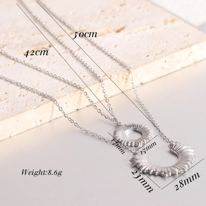 Detail view of 304 stainless steel necklaces showing sizes 42cm and 50cm with coin pendants