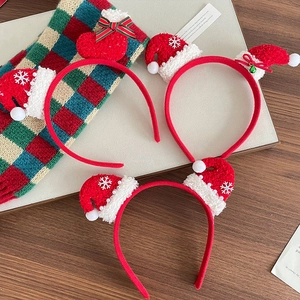 Three-piece red Christmas headband set with plush hat, stocking and snowflake decor