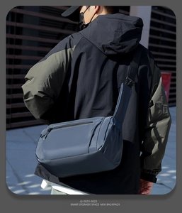 Detail of waterproof crossbody bag with hidden zipper pocket and wide shoulder strap
