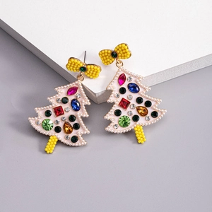 Detailed close-up of Christmas tree earrings with colorful rhinestones and yellow bows