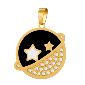 Macro detail of gold round pendant with black moon, stars and inlaid clear crystals