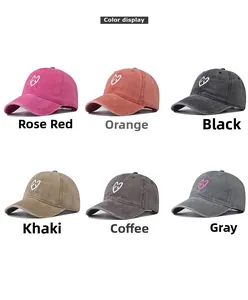 Color options of washed cotton baseball caps with embroidered heart and letter design