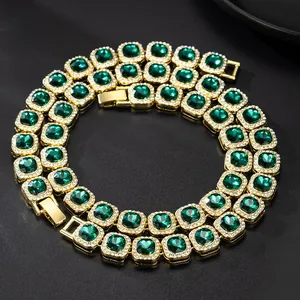 Close-up of 13mm gold Cuban chain with emerald green square stone and iced-out diamonds