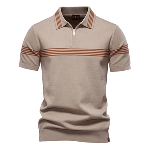 Macro detail of khaki knit polo shirt featuring orange stripes and zipper collar