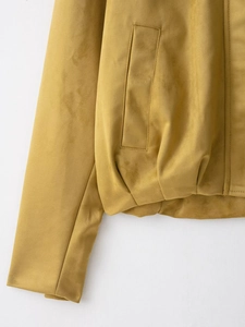 Detail of suede pilot jacket showing mustard yellow fabric and pocket stitching