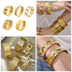 Detailed view of honeycomb pattern gold bangles set with sparkling zircon crystals