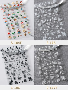 Detailed close-up of 5D embossed nail stickers featuring floral and cartoon patterns