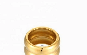 Detailed view of wide 18K gold-plated stainless steel ring with elegant mirror reflection