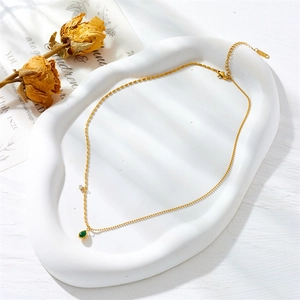 Elegant 18K gold plated chain necklace with a green water drop pendant and zircon detail