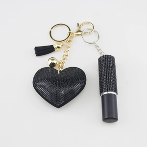 Black heart perfume bottle keychain with crystal studs and elegant tassel decoration