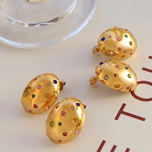 French vintage gold oval earrings with colorful crystals and hammered texture