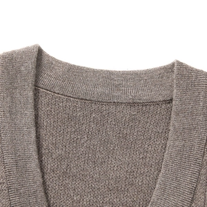 Detail of the V-neckline and fine ribbing texture on this brown knitted vest for men