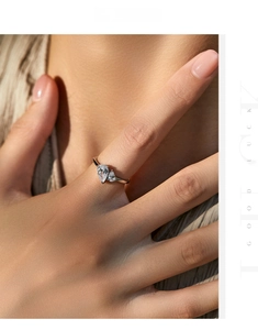 Detail of s925 silver ring featuring two interlocking pear-shaped cubic zirconia stones