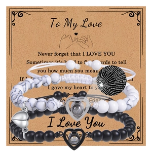 Detail of magnetic couple bead bracelets with projection stone on heart charm