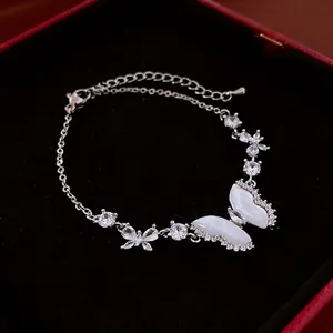 Elegant silver bracelet featuring mother of pearl butterfly and shimmering cubic zirconia