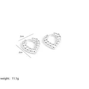 Detail view of twisted silver heart earrings showing 2cm size and 11.1g weight