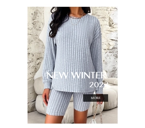 Detail view of light grey ribbed knit two-piece lounge set with top and cycling shorts
