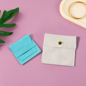 Microfiber jewelry snap pouch in Tiffany blue and cream white on lavender backdrop