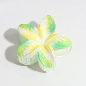 Detail of frangipani hair claw clip with yellow and green gradient matte resin finish