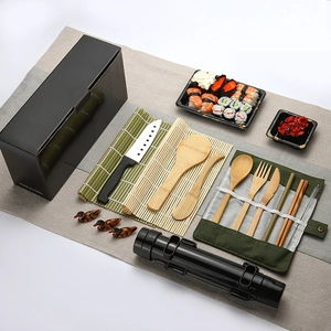 Complete bamboo sushi making kit with rolling mats and utensils in a black gift box