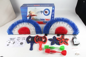 Detail view of the complete throw target game set with axes, stars, darts and instructions
