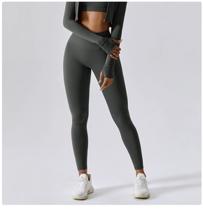 Detail showing high-waist yoga leggings and thumbhole crop top in dark gray fabric